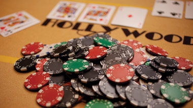 poker chips and cards on a Hollywood Casino table